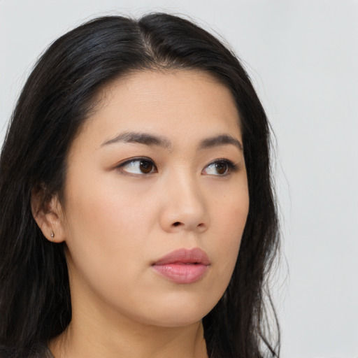 Neutral asian young-adult female with long  brown hair and brown eyes