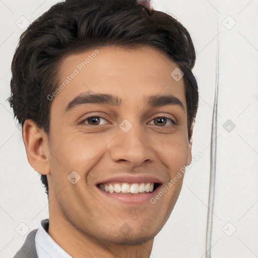 Joyful white young-adult male with short  black hair and brown eyes