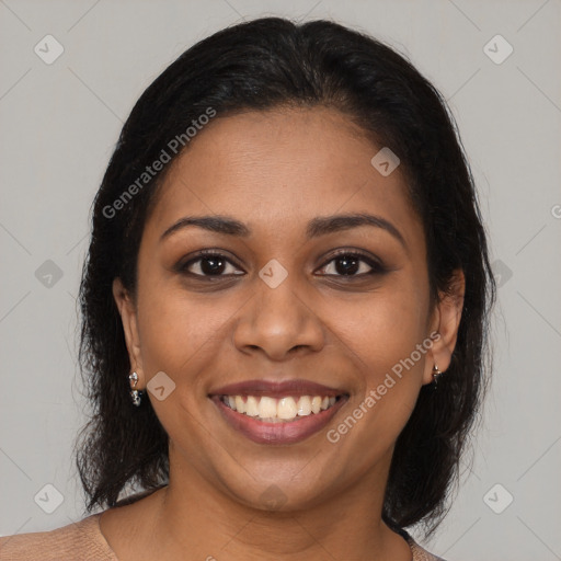 Joyful black young-adult female with long  brown hair and brown eyes