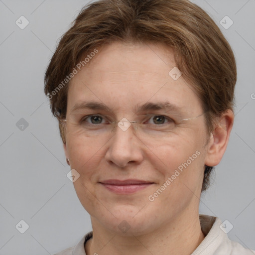 Joyful white adult female with short  brown hair and grey eyes