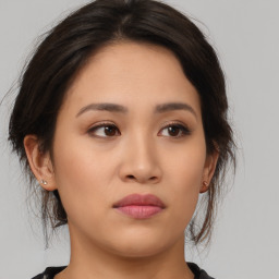 Neutral asian young-adult female with medium  brown hair and brown eyes