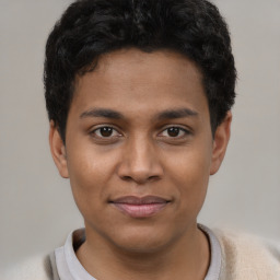 Joyful latino young-adult male with short  brown hair and brown eyes