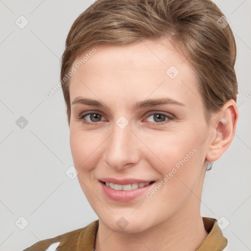 Joyful white young-adult female with short  brown hair and brown eyes