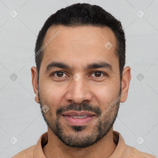 Joyful white young-adult male with short  black hair and brown eyes