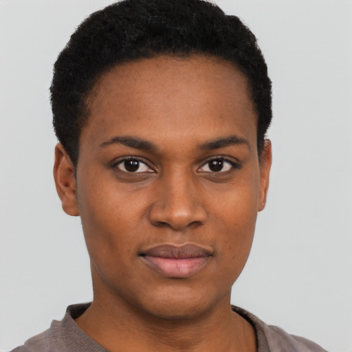 Joyful black young-adult female with short  black hair and brown eyes