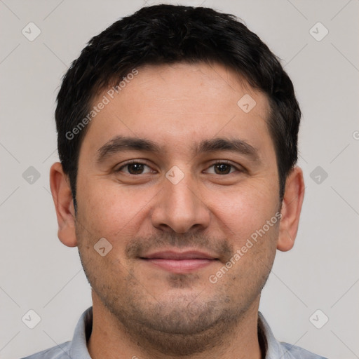 Joyful white young-adult male with short  black hair and brown eyes