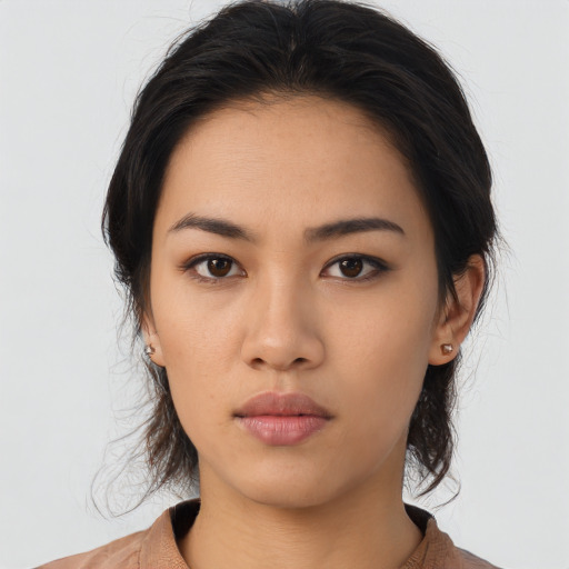 Neutral asian young-adult female with medium  brown hair and brown eyes