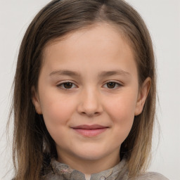 Joyful white child female with long  brown hair and brown eyes