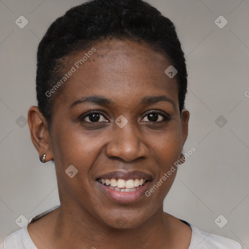 Joyful black young-adult female with short  black hair and brown eyes