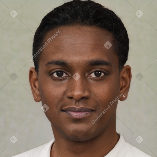 Joyful black young-adult male with short  black hair and brown eyes