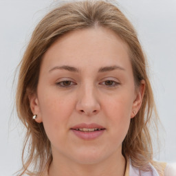 Joyful white young-adult female with medium  brown hair and blue eyes