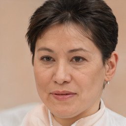 Joyful white adult female with short  brown hair and brown eyes