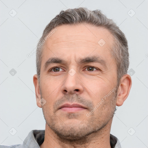 Neutral white adult male with short  brown hair and brown eyes