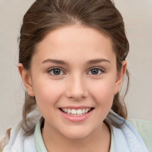 Joyful white child female with medium  brown hair and brown eyes