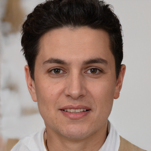 Joyful white adult male with short  brown hair and brown eyes