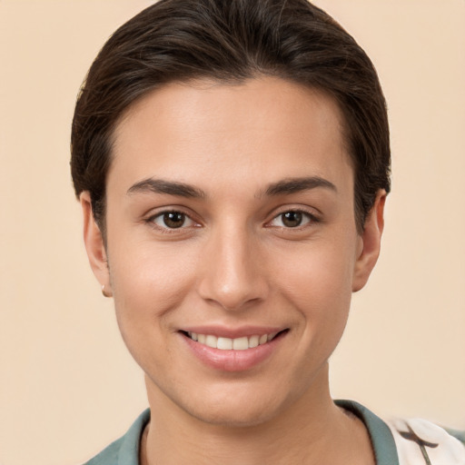 Joyful white young-adult female with short  brown hair and brown eyes