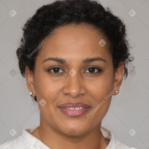 Joyful latino adult female with short  brown hair and brown eyes