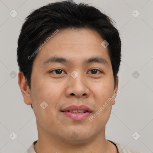 Joyful asian young-adult male with short  brown hair and brown eyes