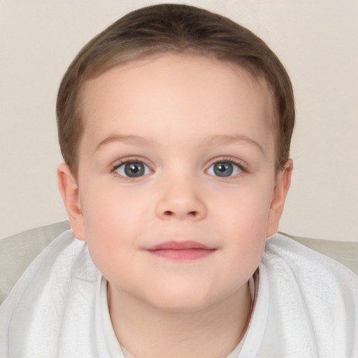 Joyful white child female with short  brown hair and blue eyes