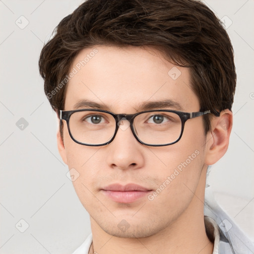 Neutral white young-adult male with short  brown hair and brown eyes