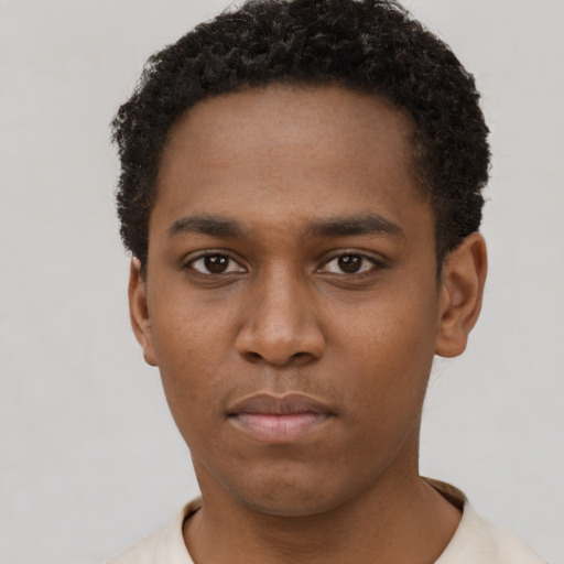 Neutral black young-adult male with short  brown hair and brown eyes