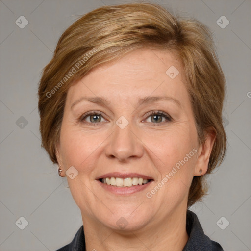 Joyful white adult female with medium  brown hair and grey eyes