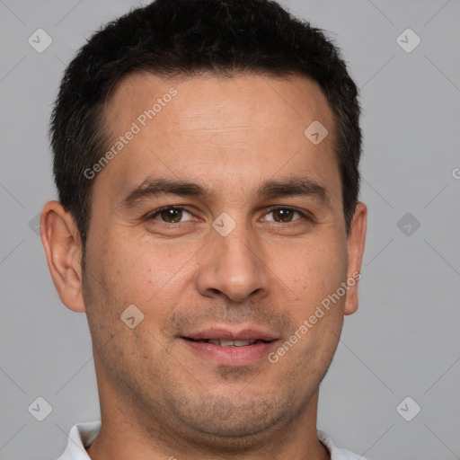 Joyful white adult male with short  brown hair and brown eyes