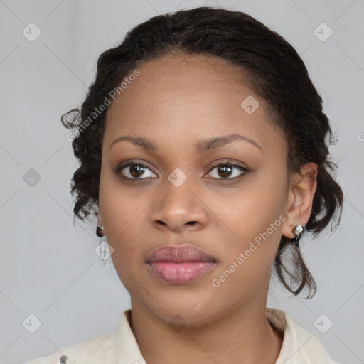 Joyful black young-adult female with medium  brown hair and brown eyes