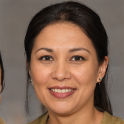 Joyful white adult female with medium  brown hair and brown eyes