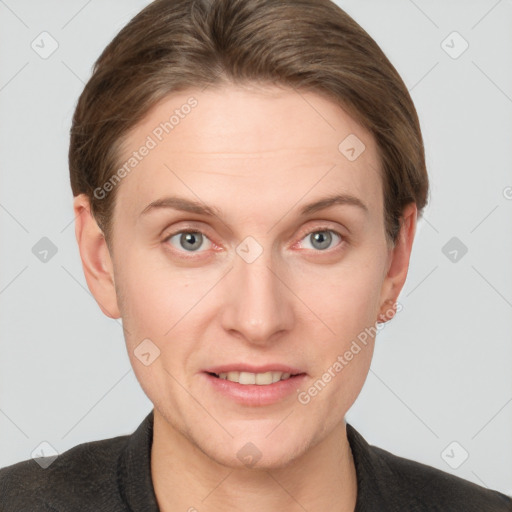 Joyful white young-adult female with short  brown hair and grey eyes