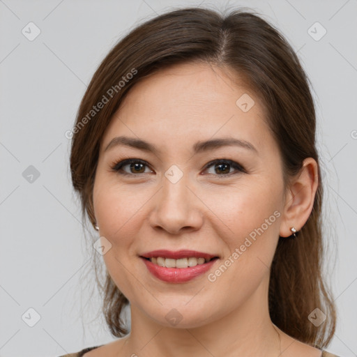 Joyful white young-adult female with medium  brown hair and brown eyes