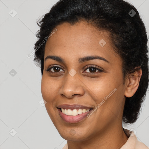 Joyful latino young-adult female with short  brown hair and brown eyes