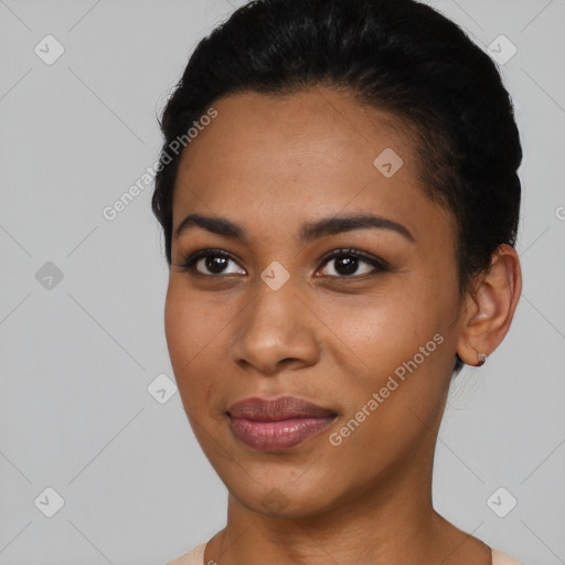 Joyful latino young-adult female with short  black hair and brown eyes