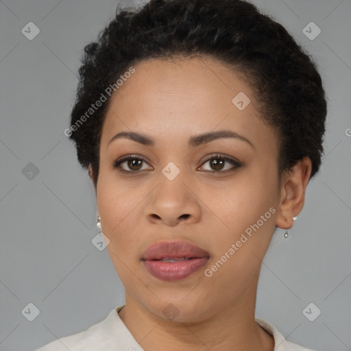 Joyful black young-adult female with short  brown hair and brown eyes