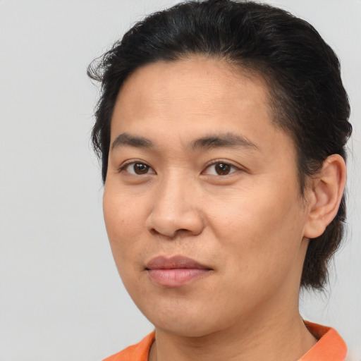 Joyful asian young-adult female with short  brown hair and brown eyes