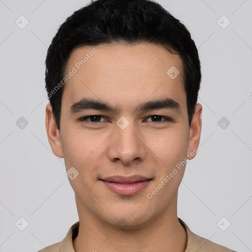 Joyful white young-adult male with short  black hair and brown eyes