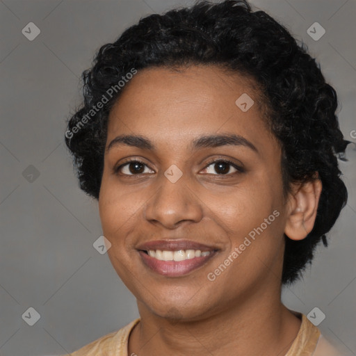 Joyful black young-adult female with short  black hair and brown eyes