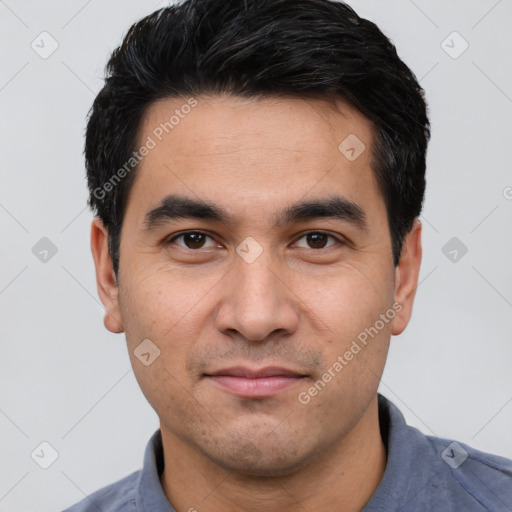 Joyful white young-adult male with short  black hair and brown eyes