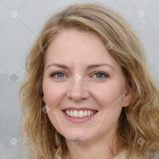 Joyful white adult female with long  brown hair and brown eyes