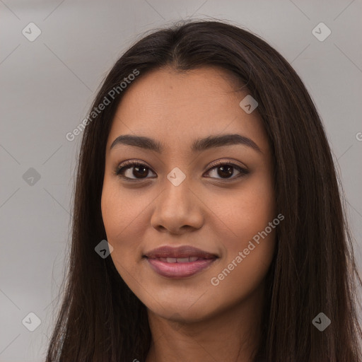 Joyful latino young-adult female with long  brown hair and brown eyes