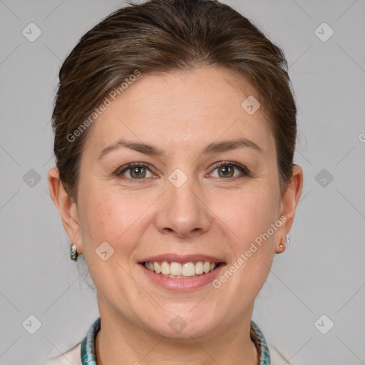 Joyful white adult female with short  brown hair and grey eyes