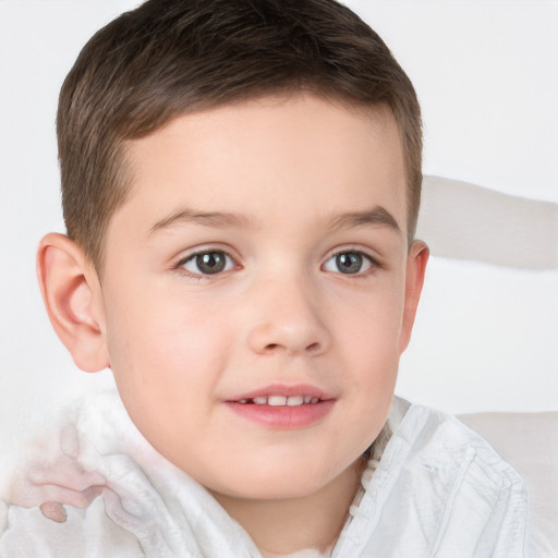 Joyful white child male with short  brown hair and brown eyes