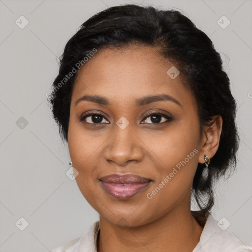 Joyful black young-adult female with medium  black hair and brown eyes