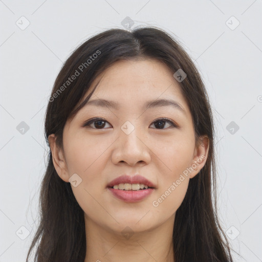 Joyful asian young-adult female with long  brown hair and brown eyes