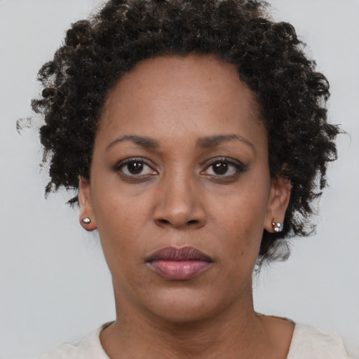 Neutral black adult female with short  brown hair and brown eyes