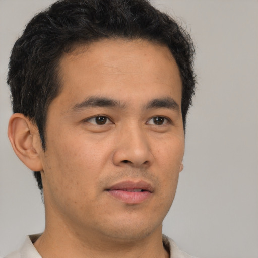 Neutral latino young-adult male with short  brown hair and brown eyes