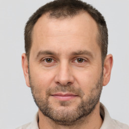 Joyful white adult male with short  brown hair and brown eyes