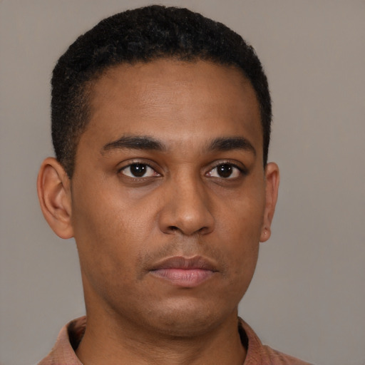 Neutral latino young-adult male with short  brown hair and brown eyes