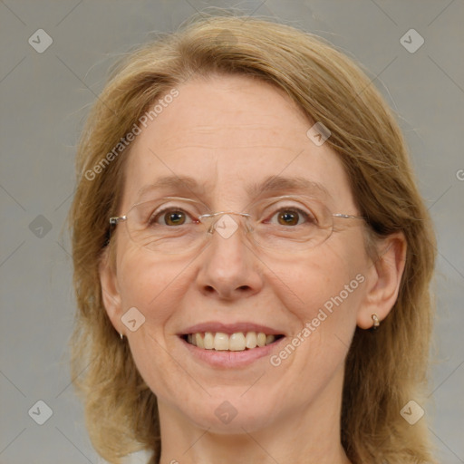 Joyful white adult female with medium  brown hair and blue eyes