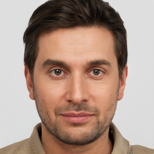 Joyful white young-adult male with short  brown hair and brown eyes